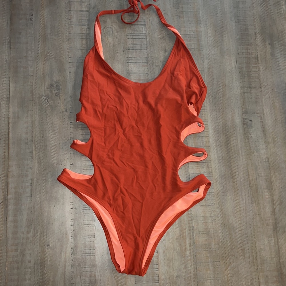 Burnt orange one piece cut out swim suit!! So cute